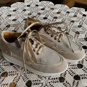 Stylish Beige Sneakers with Gold Accents